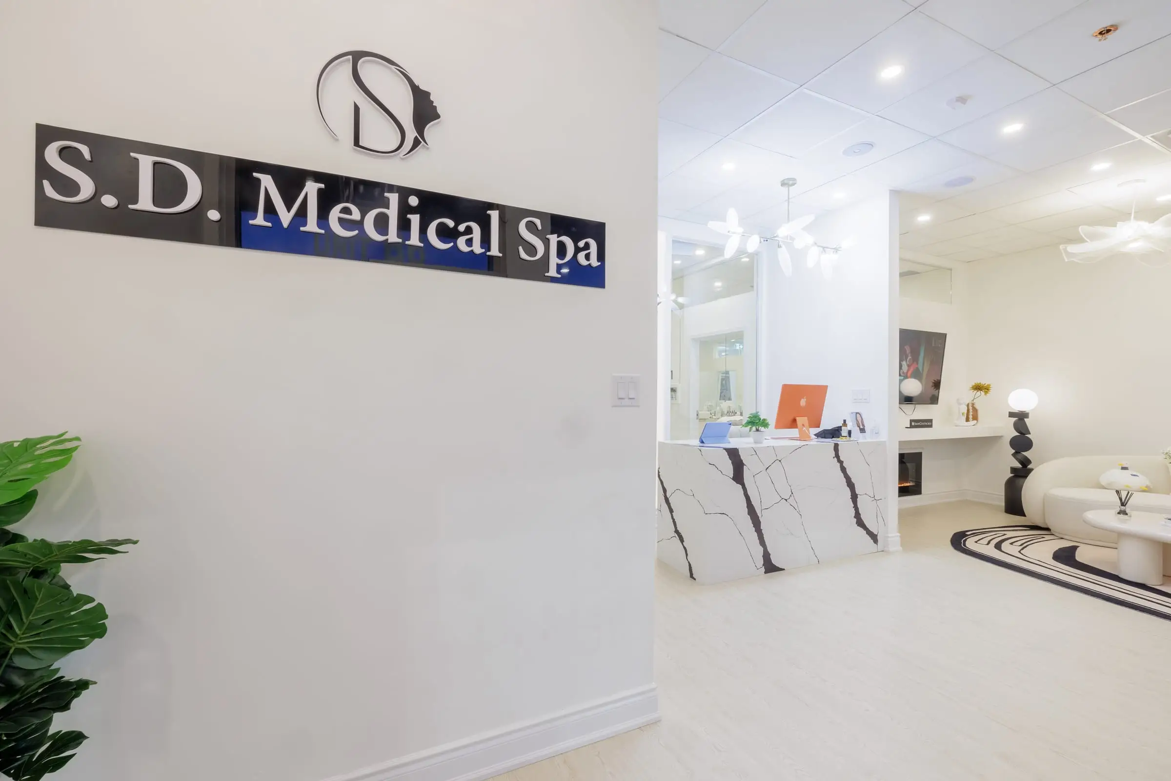 The entrance of S.D. Medical Spa, with the sign on the wall.